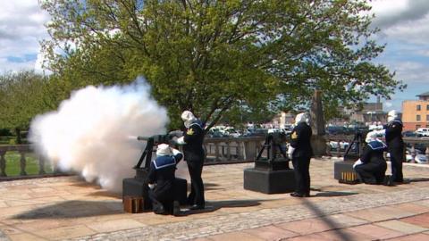 A 21-round gun salute at HMS Drake on Coronation Day, 2024