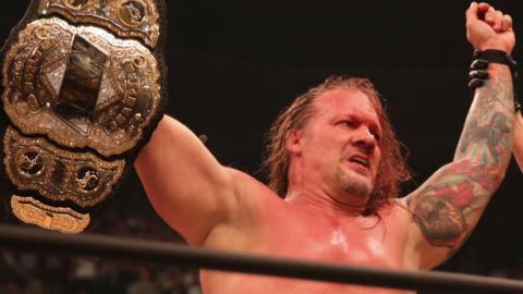 Chris Jericho holding the AEW title belt