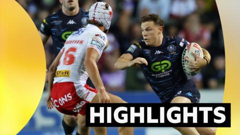 Wigan's Jai Field (left) puts his right elbow out to prepare for a tackle while running with the ball in his left arm