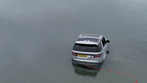 Land Rover Discovery in water off Abersoch