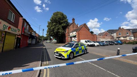 A police cordon closing off a street
