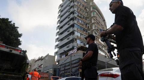 Police at the site of a drone strike in Tel Aviv.