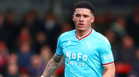 Walsall defender Rico Browne in the light blue away kit.