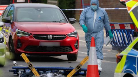 A member of the forensic team works at the scene, after a man was arrested following a stabbing incident in the Golders Green area, which is home to a large Jewish population, in London, Britain, April 29, 2026. 