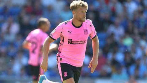 Cameron McGeehan in action for Northampton Town at Cardiff City in April 2026