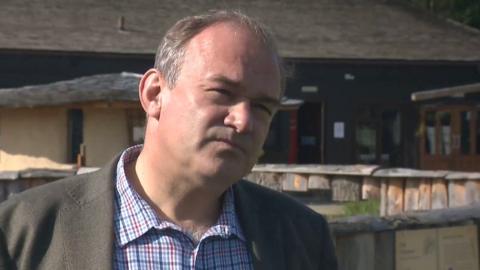 Still from TV interview with Ed Davey at zoo