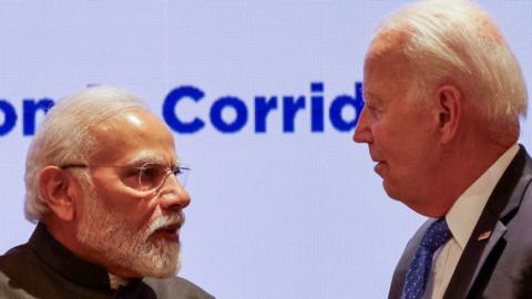 India's Prime Minister Narendra Modi (L) and US President Joe Biden speak after a session as part of the G20 Leaders' Summit at the Bharat Mandapam in New Delhi on September 9, 2023.