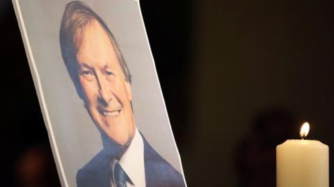 A picture of Sir David Amess at a service of reflection at the church of St Michael"s and all Angels, in Leigh-on-Sea