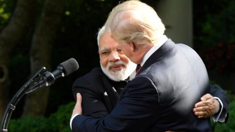 Donald Trump hugs Modi