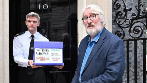 Jeremy Paxman presenting the Parky Charter at No 10