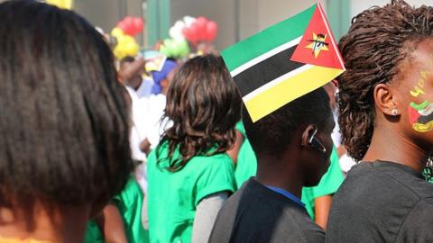 Mozambicans displaying the national colours