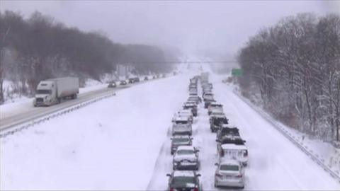 Cars stuck on snowy highway