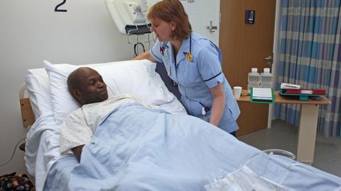 NHS patient in a bed