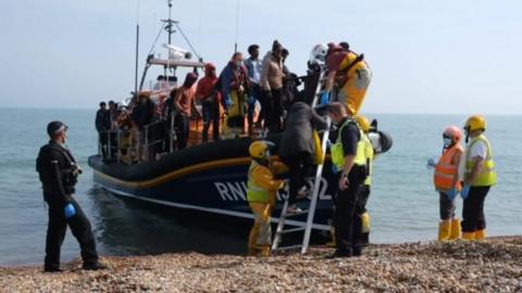 A boat of migrants arriving in Kent