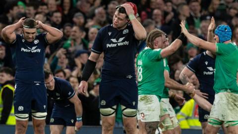 Irish players celebrate during their 17-13 win over Scotland