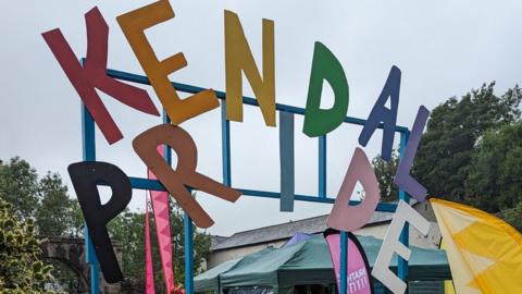 A sign saying Kendal Pride