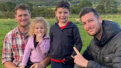 Ciaran McNichol, his children Connie and Freddie, with Charles Attonaty