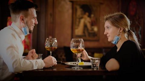 People chatting in a pub