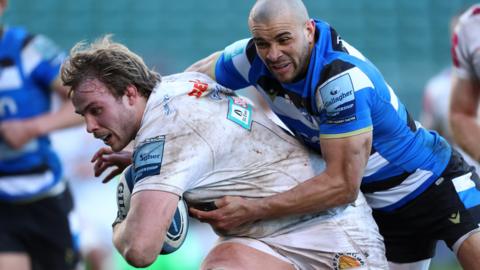 Jonny Gray holds of Jonathan Joseph to score for Exeter