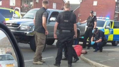 Still of mobile-phone footage showing Dan Sullivan's arrest