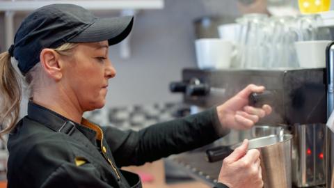 Woman working as barista