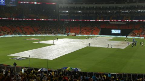Covers on in Ahmedabad as the IPL final is delayed by rain