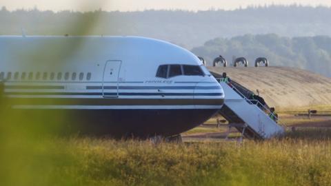 A plane which was thought to contain asylum seekers being deported to Rwanda at MOD Boscombe Down base in Wiltshire