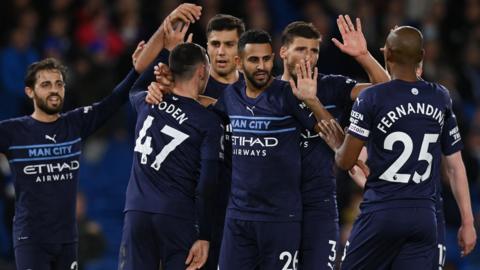 Manchester City midfielder Riyad Mahrez celebrates with team-mates