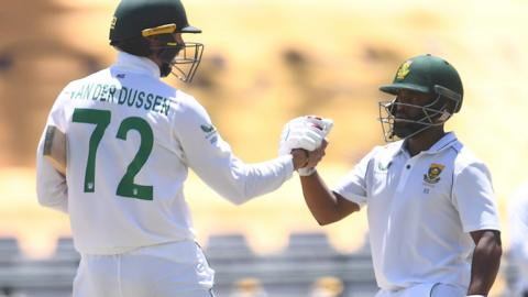 Rassie van der Dussen and Temba Bavuma celebrate victory over India