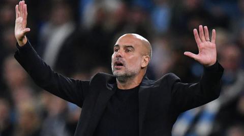 Pep Guardiola gesticulates