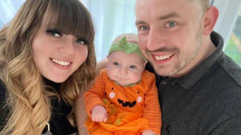 Demi-Louise Bailey with her partner and their baby girl Harper
