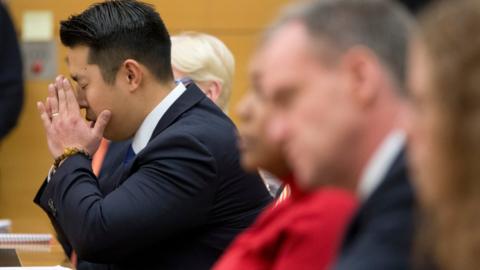 Police officer Peter Liang reacts as the verdict is read during his trial on charges in the shooting death of Akai Gurley