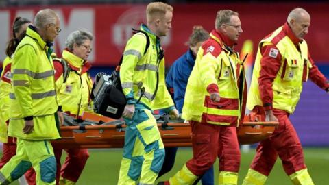 Alex Greenwood taken off on stretcher