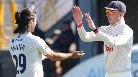 Essex players celebrate a wicket against Northamptonshire