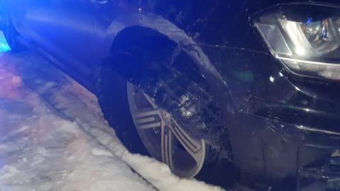 Tyre hanging off car wheel