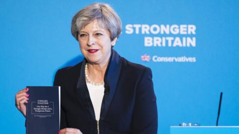 Theresa May holds the Conservative party's election manifesto