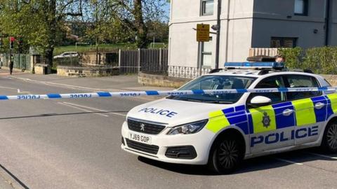 Police car and cordon outside Allerton Grange School