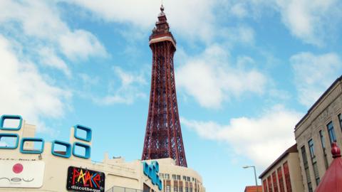 Blackpool Tower looms over Golden Mile