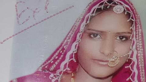 Lakshmi dressed in pink coloured bridal finery at her wedding in 2016