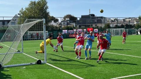Action between Jersey Bulls and Hastings United