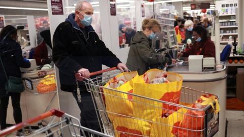 Shoppers in a Sainsbury's store