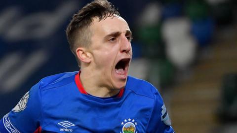 Joel Cooper celebrates scoring for Linfield