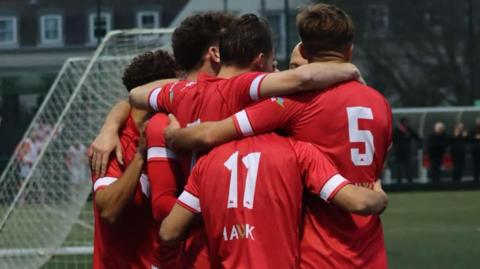 Jersey Bulls players celebrate a goal