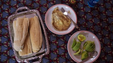 Bread with eggs for breakfast. Bamako, Mali, 5 February 2019.