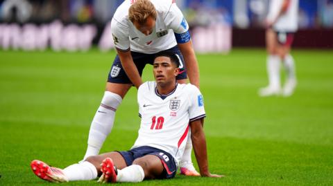 Jude Bellingham is sitting and looks dejected after England's goalless draw with Ghana