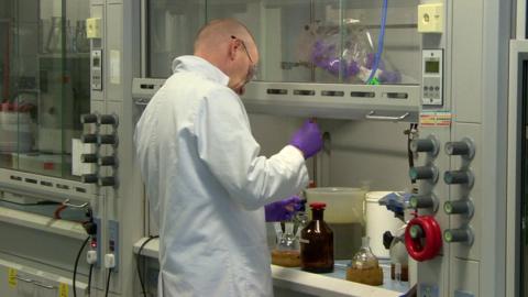 A scientist working in a lab.