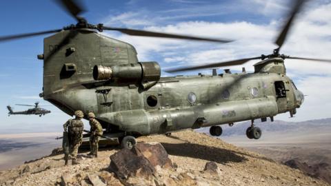 A Royal Air Force Chinook, from RAF Odiham, drops troops from 40 Commando Royal Marines onto a mountain peak in the Mojave desert during Exercise Black Alligator