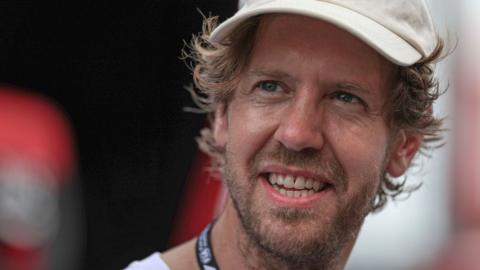 Sebastian Vettel smiles at the Japanese Grand Prix