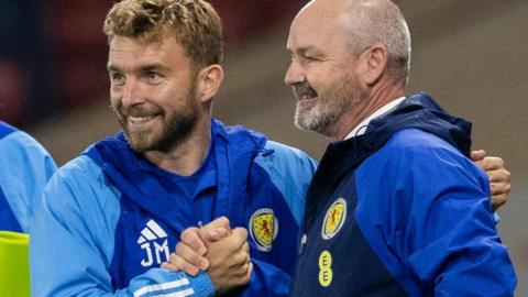 Scotland's James Morrison and Steve Clarke celebrate