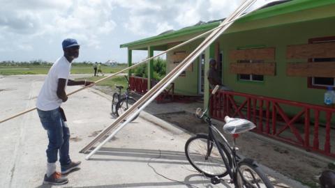 KK Payne helps fix the local bakery on Barbuda